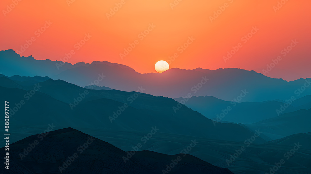 A beautiful sunset over a mountain range with a large sun in the sky