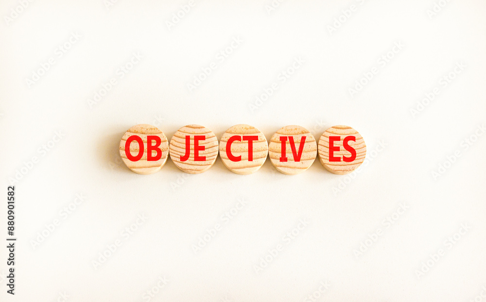 Objectives symbol. Concept word Objectives on beautiful wooden circles. Beautiful white background. Business objectives concept. Copy space.