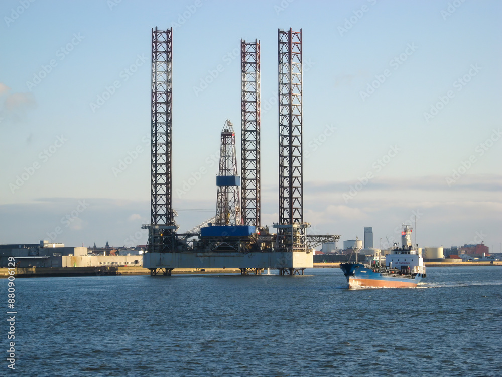Jack-Up Barge, platform and the vessel at sunset.  offshore energy