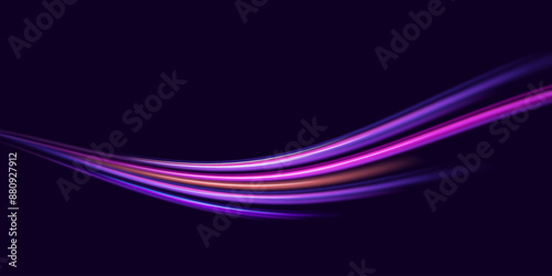 Neon color glowing lines background, high-speed light trails effect. Modern abstract high-speed light motion effect on black background. Light motion effect, slow shutter of traffic.