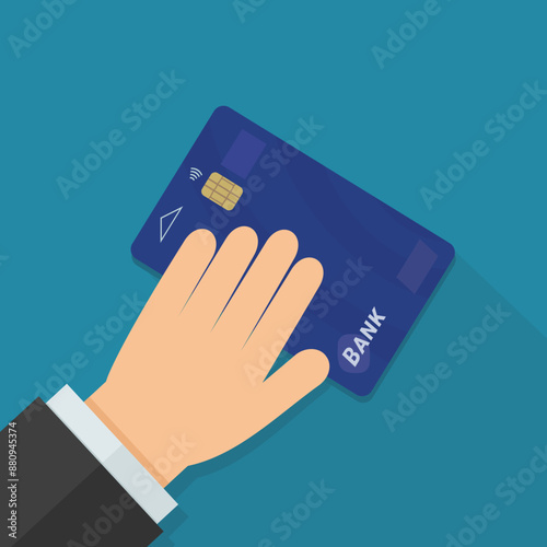 A hand presents a blue smart bank card on a blue background with long shadow in flat design style
