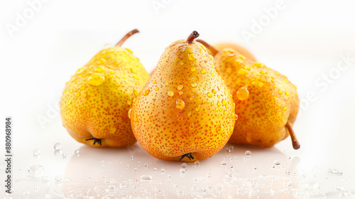 Close-up of three fresh yellow pears with water droplets on a white background, highlighting their juicy and vibrant appearance. Perfect for food, health, and nutrition-related themes.