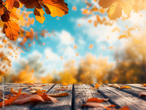 Beautiful autumn background with a wooden table and blurred orange leaves on a blue sky on a sunny day, in the style of product display montage template.