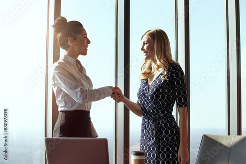 Fotografie Business, women and shaking hands in office for deal, vendor and trade collaboration for partnership