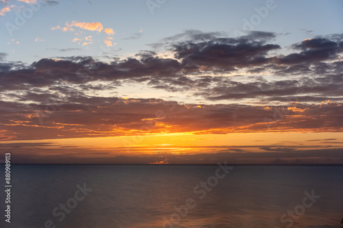 Spectacular sunset nature background with colorful romantic sky and colorful sea water. High quality photo