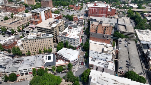 City skyline of Asheville, NC at the base of the Blue Ridge Mountains in North Carolina, a living and vacation destination in the Southern, United States showing architecture of buildings and streets