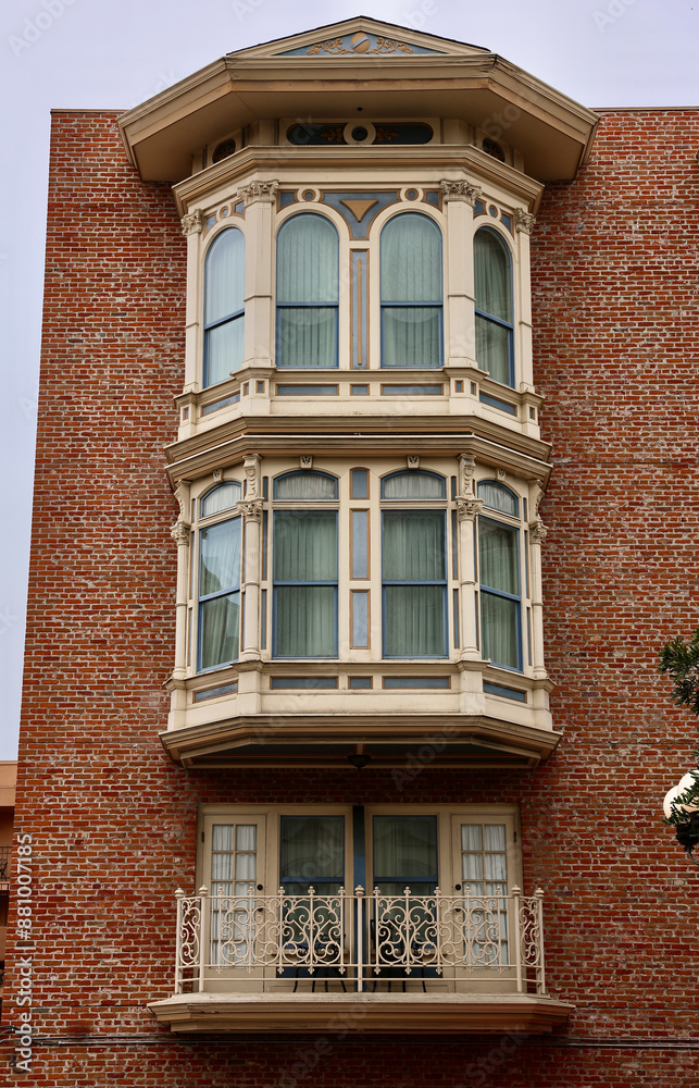 Obraz premium old brick building with decorative bay windows