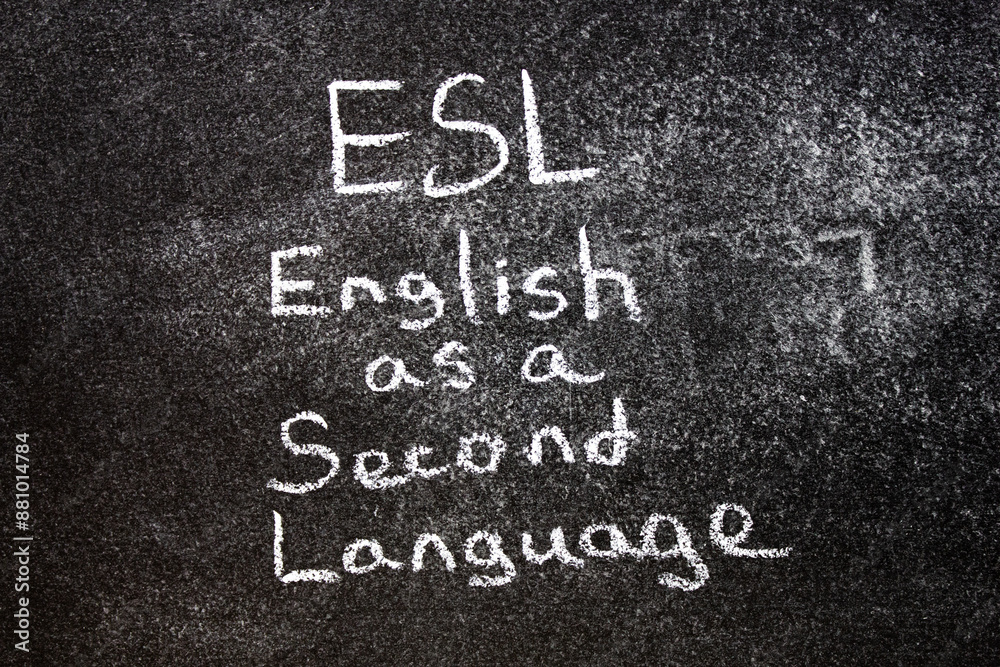 Fototapeta premium ESL English second language. ESL text written in chalk on the blackboard.