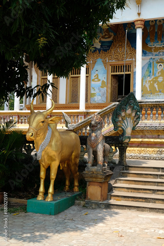 golden bull at the entrance to a Buddhist temple, Cambodia photo