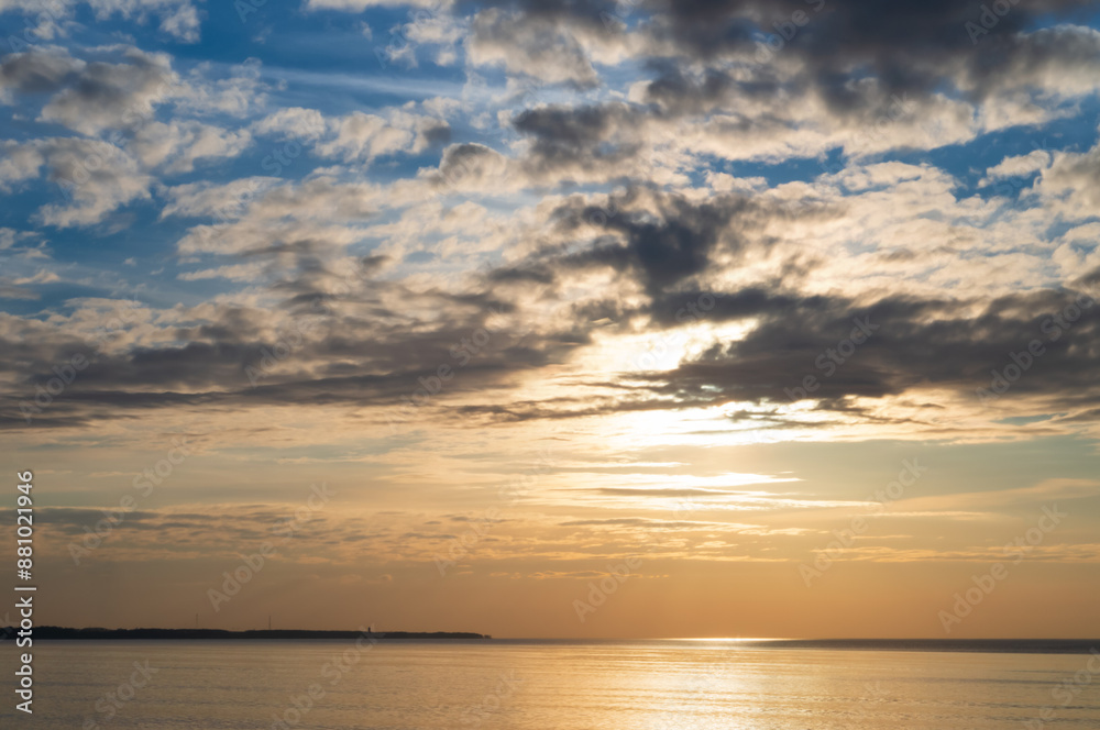 Sunset over the sea. Reflection of sunlight in the sea waves. The sky in the sunset rays. Baltic Sea. Sunset over the sea. Reflection of sunlight in the sea waves. The sky in the sunset rays. Baltic Sea.