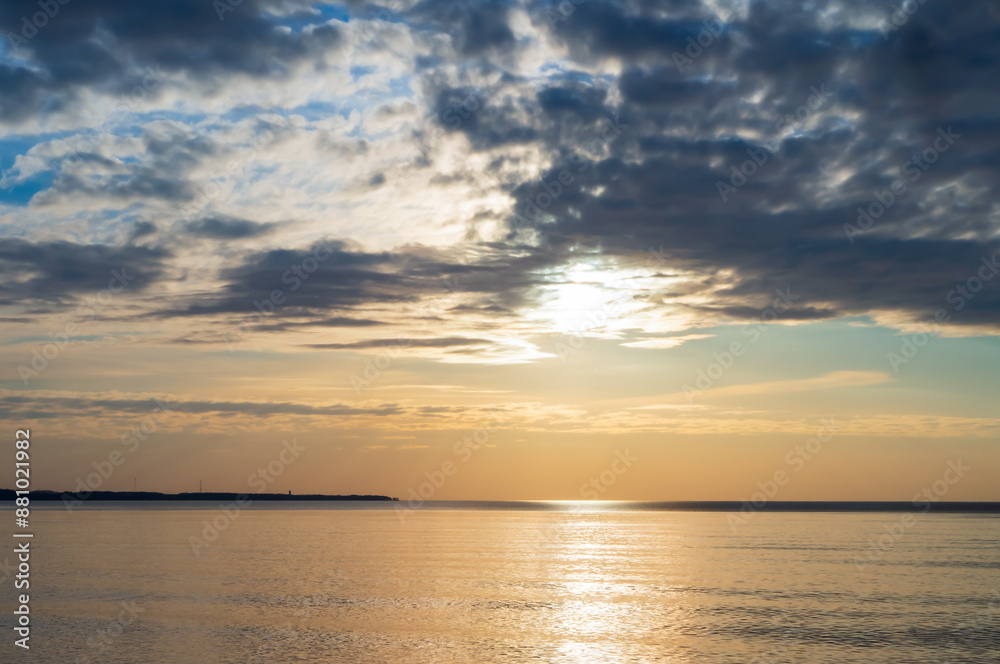 Sunset over the sea. Reflection of sunlight in the sea waves. The sky in the sunset rays. Baltic Sea. Sunset over the sea. Reflection of sunlight in the sea waves. The sky in the sunset rays. Baltic Sea.