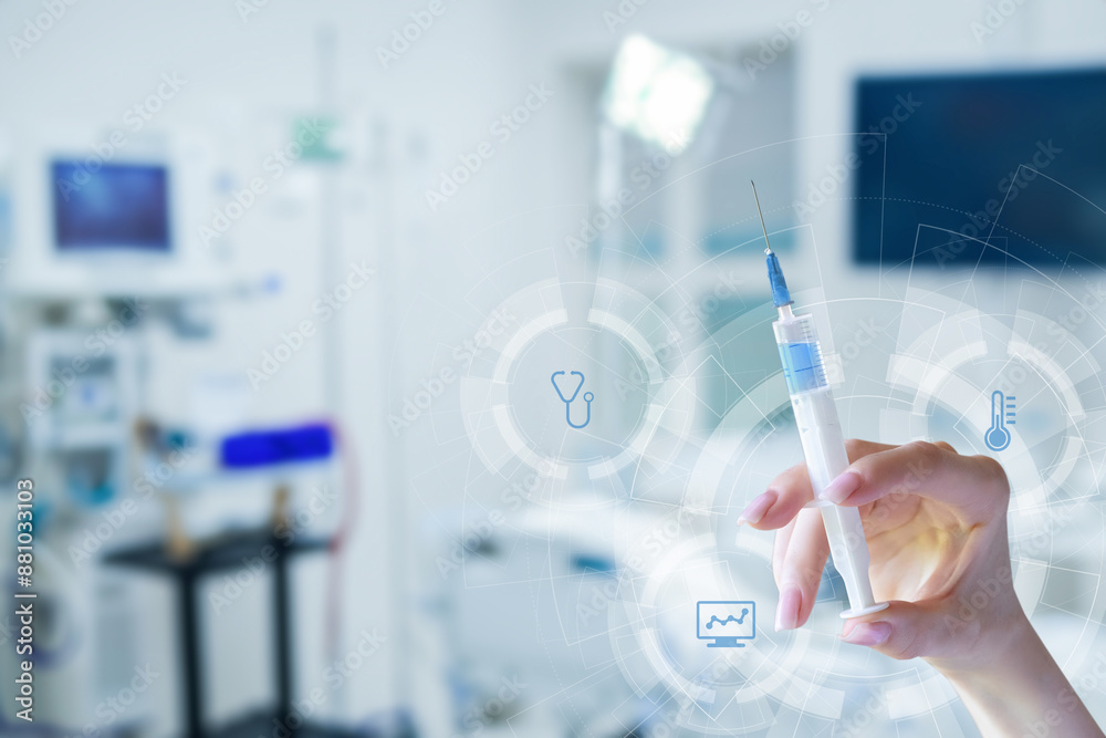 Hand holding a syringe of medicine . Hand holding a syringe of medicine .