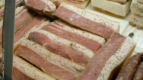 Slider of fresh lamb and beef in the meat display refrigerator.