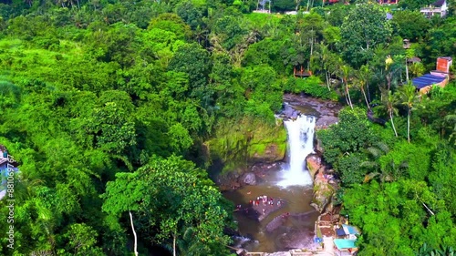 Aerial View of big waterfall surrounding by trees