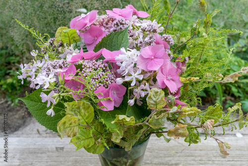 Summer bouquet with pink hydrangeas, soapwort and oregano photo