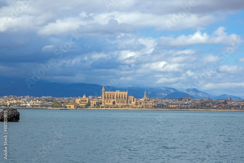 Panoramic view of Palma de Mallorca with cathedral from the harbor with storm clouds