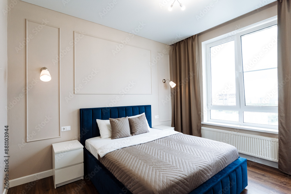 The room is beautifully furnished with a bed, nightstand, and window, combining comfort and interior design seamlessly. It offers a cozy atmosphere for relaxation and rest The room is beautifully furnished with a bed, nightstand, and window, combining comfort and interior design seamlessly. It offers a cozy atmosphere for relaxation and rest
