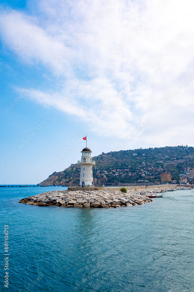 Panoramic view of old lighthouse in Alanya port. Landscape view of Mediterranean coast, Alanya, Turkey. Vertical photo Panoramic view of old lighthouse in Alanya port. Landscape view of Mediterranean coast, Alanya, Turkey. Vertical photo