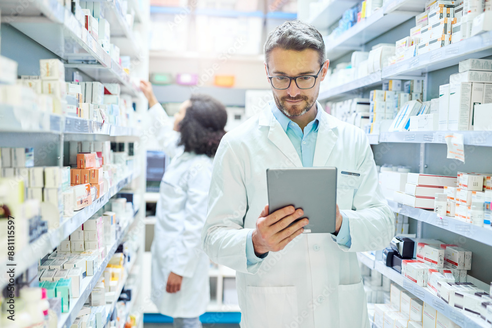 Man, pharmacy and tablet with reading for inventory, stock or drugs for order from supplier. Pharmacist, people and notes on touchscreen for sales stats, product or pills on healthcare app at shop Man, pharmacy and tablet with reading for inventory, stock or drugs for order from supplier. Pharmacist, people and notes on touchscreen for sales stats, product or pills on healthcare app at shop