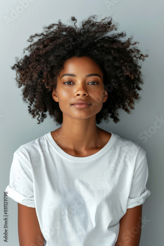 Beautiful black woman wearing bella canvas white t shirt and jeans, studio shot. Design t shirt template, print presentation mockup 