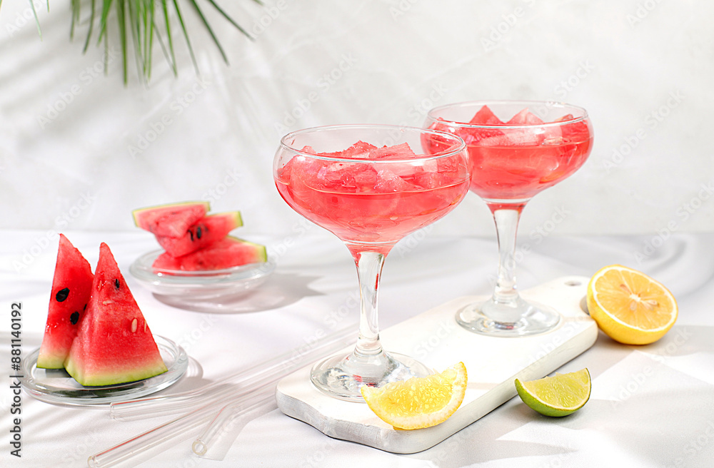 Watermelon frozen margarita cocktail with fresh slices of watermelon, lime and mint, summer party and vacation concept, bar advertising, cafe, selective focus. Watermelon frozen margarita cocktail with fresh slices of watermelon, lime and mint, summer party and vacation concept, bar advertising, cafe, selective focus.