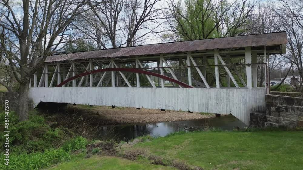 Knisely covered bridge near New Paris, PA. Shot zooms in on the side of the bridge, showing it's unique open design. Shot in early Spring.