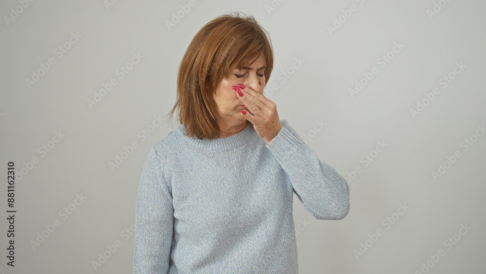 Φωτογραφία Mature woman pinching nose due to bad smell against a white isolated background