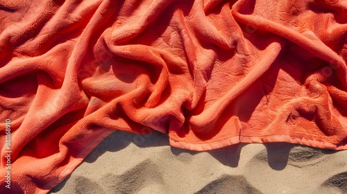 Top View of a red Towel on Sand. Beautiful Beach Vacation Background 