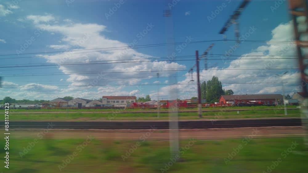 View from the window of high speed train. Beautiful trip with countryside scenery, clouds. A view of France landscape from the window of high speed train