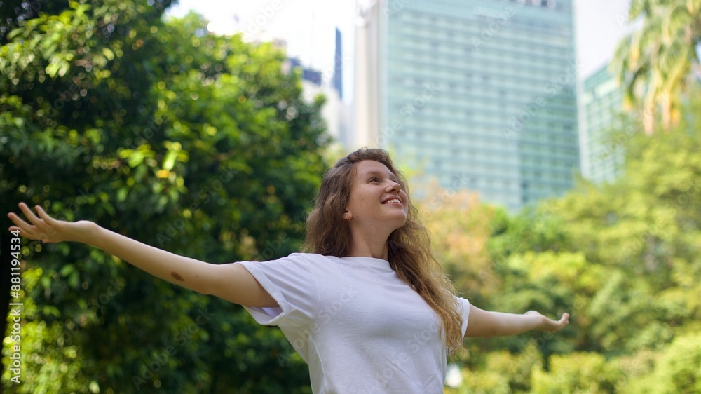portrait of a young beautiful woman in the park enjoying the warm weather in spring or summer portrait of a young beautiful woman in the park enjoying the warm weather in spring or summer