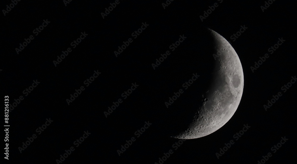 Close up picture of waxing crescent moon in dark sky Close up picture of waxing crescent moon in dark sky
