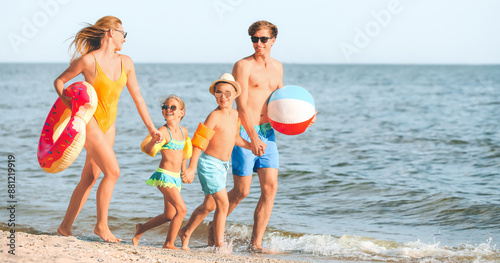Happy family on sea beach a...