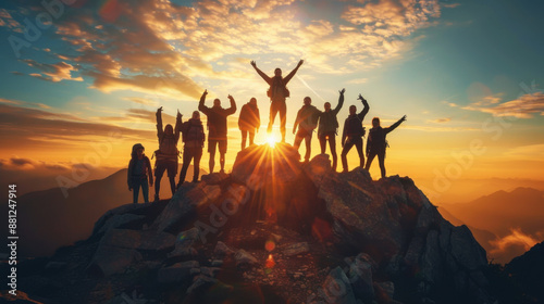 Group of hikers celebrating on a mountain peak during sunrise, symbolizing teamwork, achievement, and outdoor adventure.