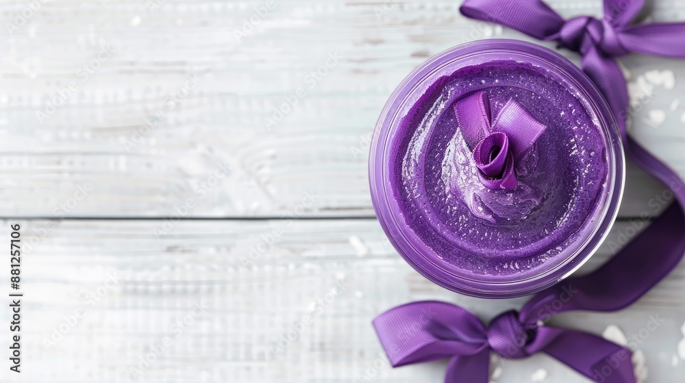 Obraz premium Purple sisal and bow adorn open jar of cream gel on white wooden background