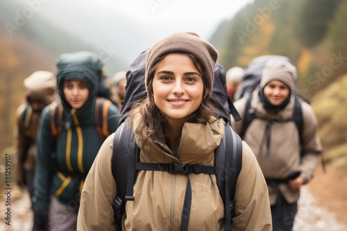 Female hiker in mountains looking at the camera during hike for optimal search relevance
