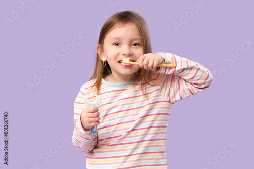 Happy little girl in pajama...