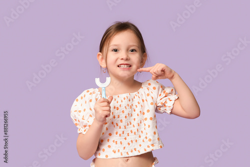 Happy little girl in pajama...