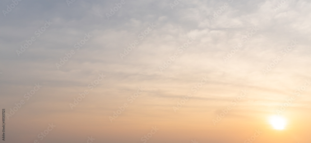 Obraz premium Beautiful morning or evening blue and orange sky taken at the sea while sunset or sunrise used as natural blackground texture in decorative art work