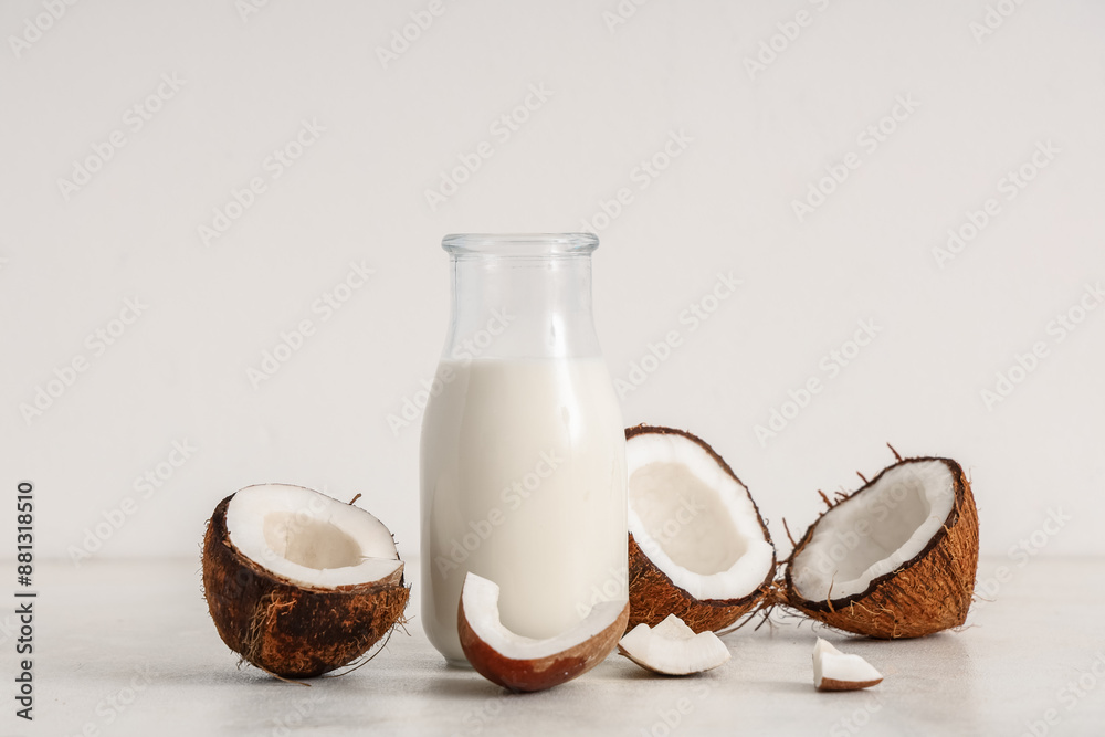 Bottle of fresh coconut milk on white background Bottle of fresh coconut milk on white background