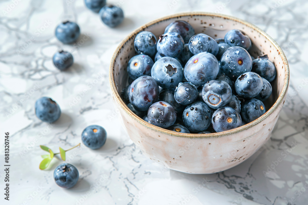 a bowl of blueberries on a marble surface a bowl of blueberries on a marble surface
