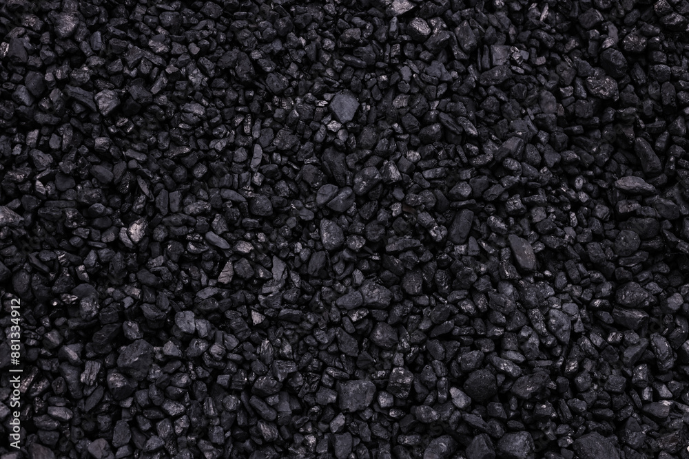 Black textured background made with black coals Black textured background made with black coals