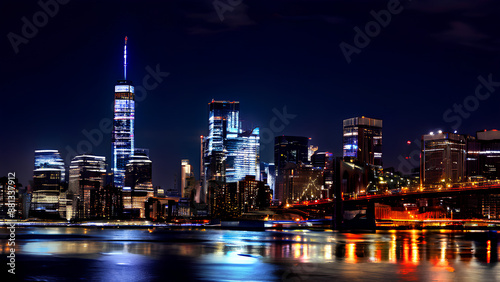 NYC's glittering skyline! Skyscrapers shine bright against the night sky