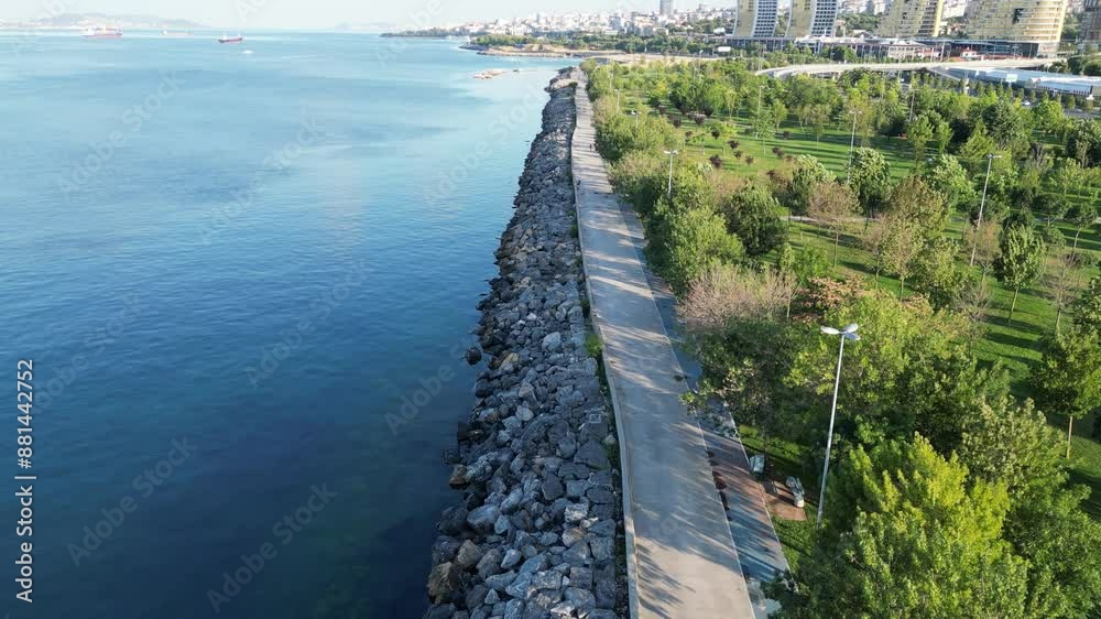 Scenic Coastal Park with Modern High-Rise Buildings Scenic Coastal Park with Modern High-Rise Buildings
