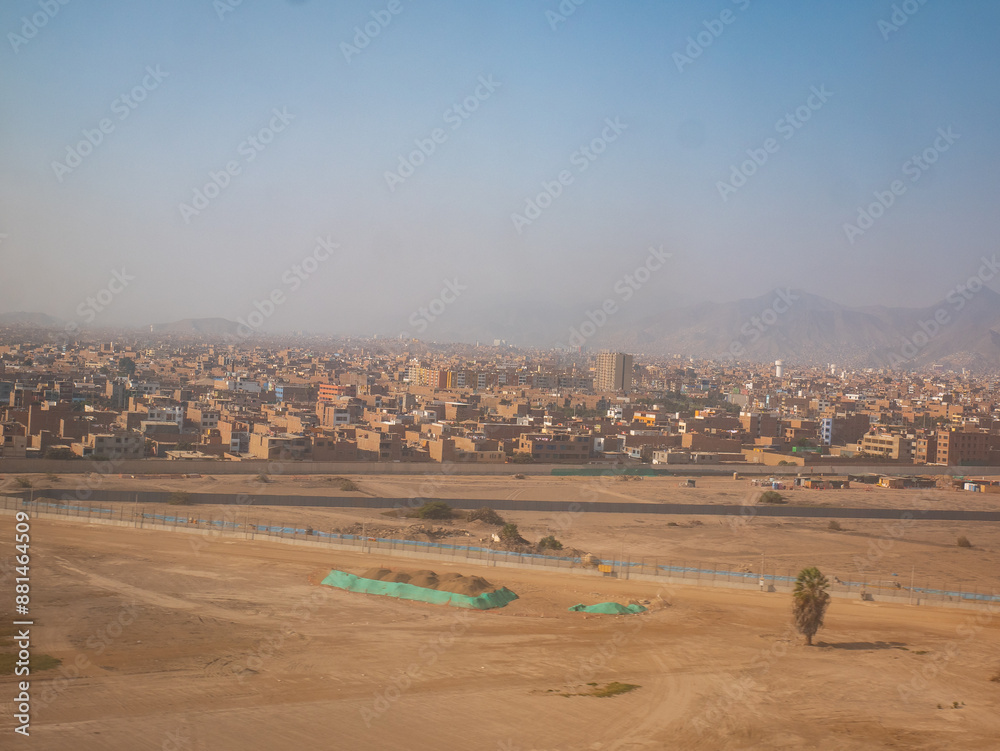 View of the City, Dry and Yellow Ground with a Cloudy and Polluted Sky in Lima, Peru