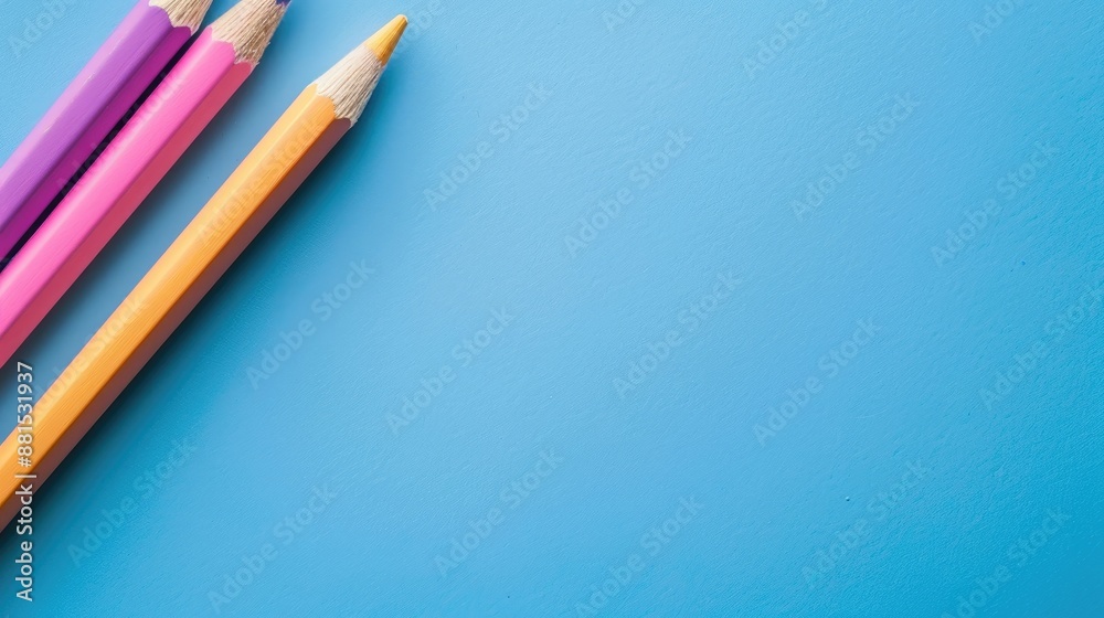Obraz premium Color pencil close up on blue background with space for copy