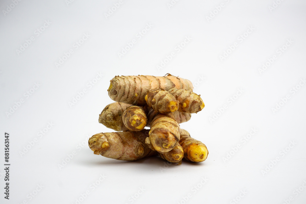 Turmeric is a typical Indonesian spice that is yellow in color. in Groups. typical Indonesian. isolated on white background. Turmeric is a typical Indonesian spice that is yellow in color. in Groups. typical Indonesian. isolated on white background.