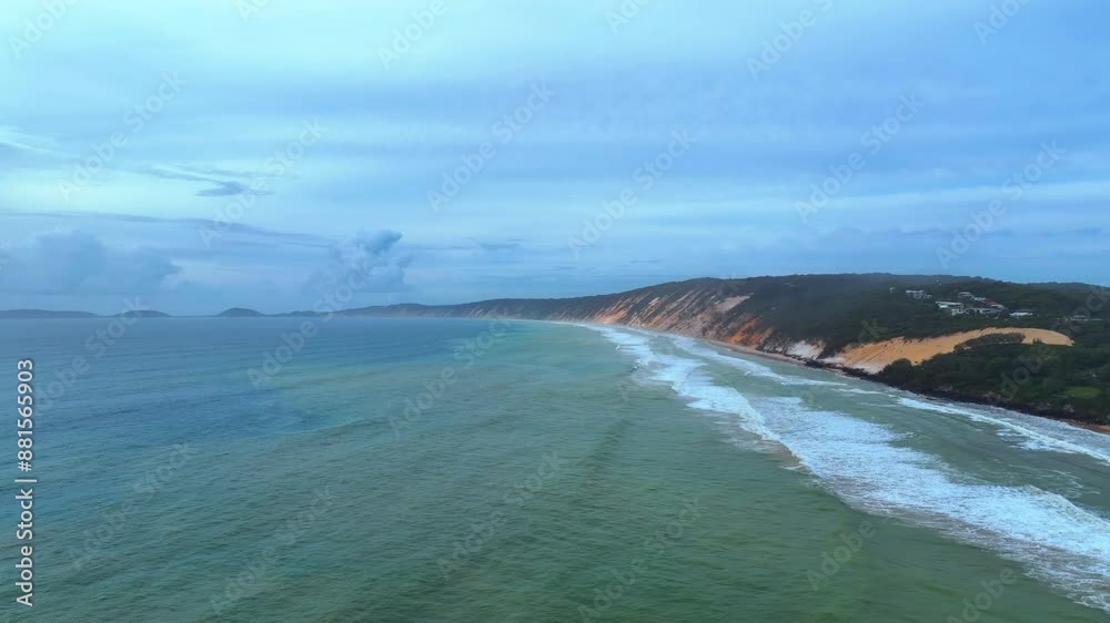 Aerial captures the moody and mysterious atmosphere of the coast running from Rainbow Beach's sand blow through to Double Island Point in Queensland's Great Sandy National Park. Aerial captures the moody and mysterious atmosphere of the coast running from Rainbow Beach's sand blow through to Double Island Point in Queensland's Great Sandy National Park.