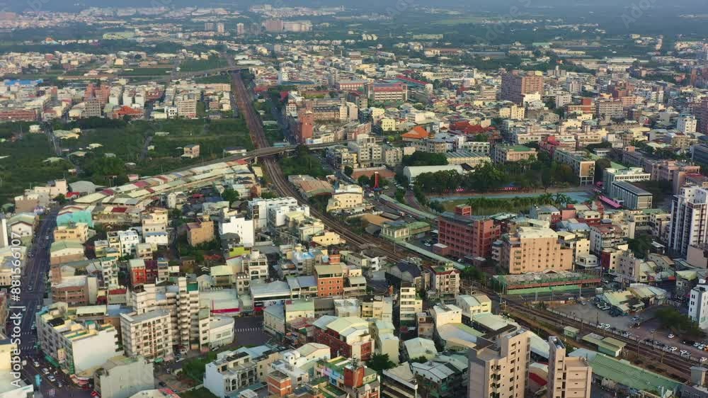 Aerial views, drone flyover capturing the sunset downtown cityscape of Douliu city, Yunlin county, the countryside of Taiwan. Aerial views, drone flyover capturing the sunset downtown cityscape of Douliu city, Yunlin county, the countryside of Taiwan.