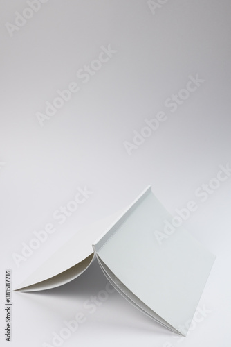 A blank open book on a white background, with copy space