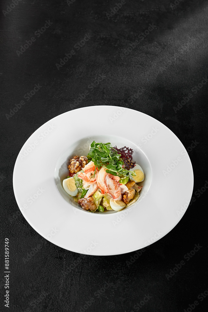 Fresh Crab Salad with Egg and Vegetables in White Bowl on Black Background Fresh Crab Salad with Egg and Vegetables in White Bowl on Black Background